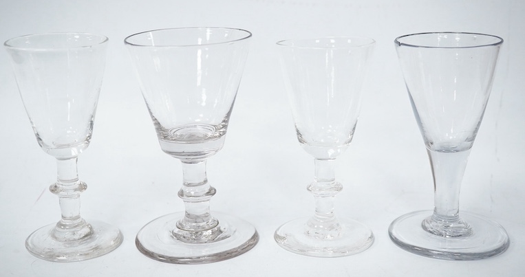 Four late 18th century ale wine and dram glasses, tallest 10.5cm. Condition - largest glass has a fine chip to rim